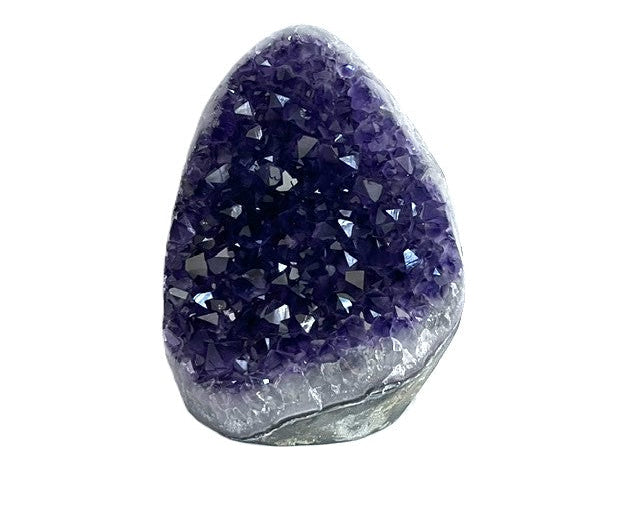 Front view of Brazilian teardrop amethyst geode with deep purple crystal points and a pale mineral rim